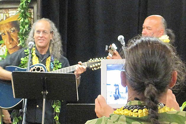 Pili with Kumu Pekelo Day and the back of judge Mark Keali‘i Ho‘omalu's head